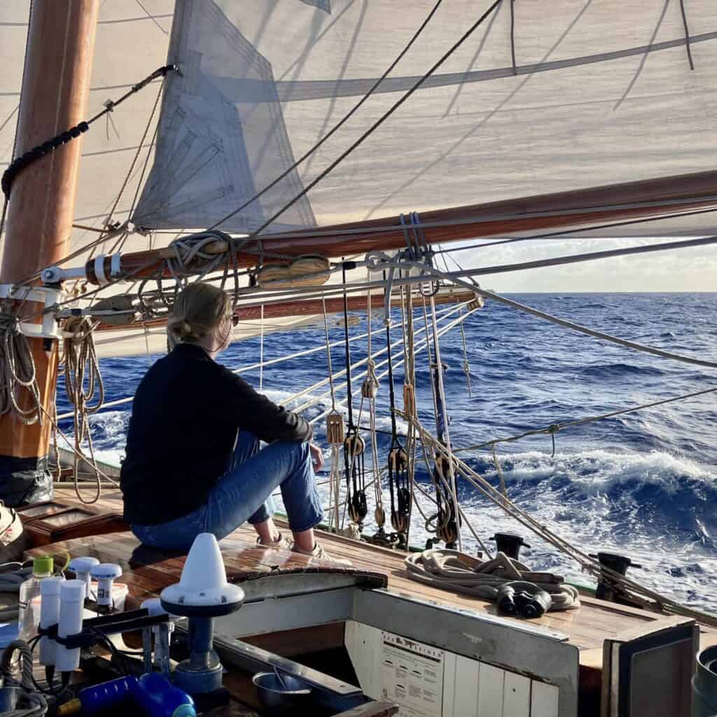 Tecla crew on deck under sail in the sunshine