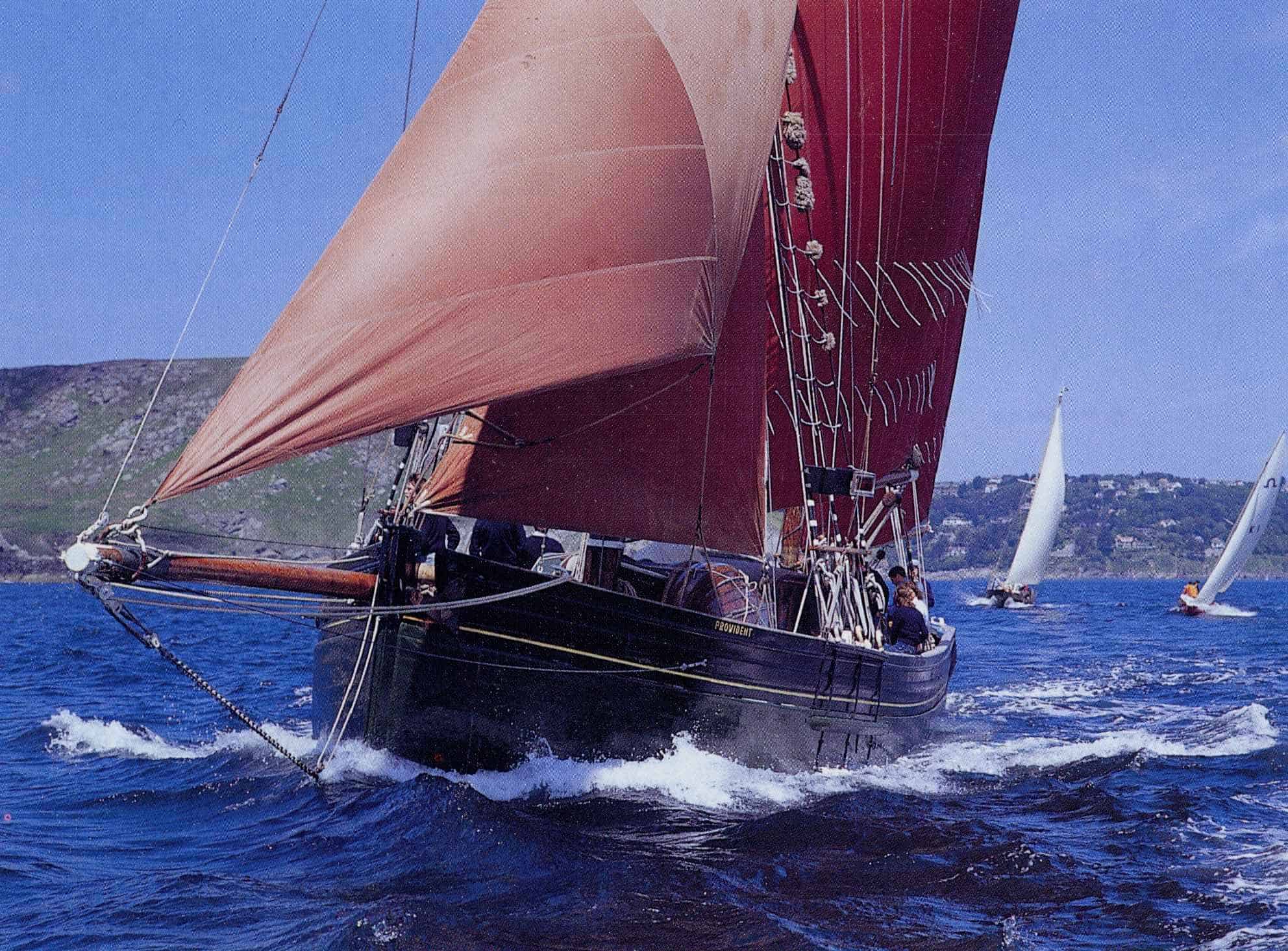 Red sail make Provident very noticeable at sea.  Sailing Holidays on Provident with Classic Sailing