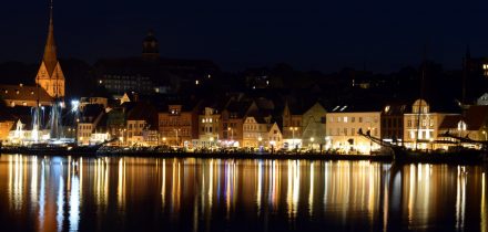 flensburg waterfront and sailing ships at night