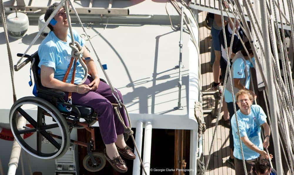 Going aloft on Lord Nelson in a wheel chair, specially adapted ship to take disabled sailors sailing