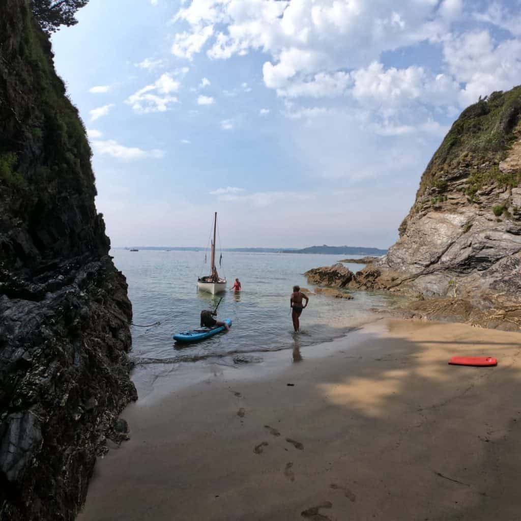 finding remote coves and caves on an outdoor girl sailing adventure
