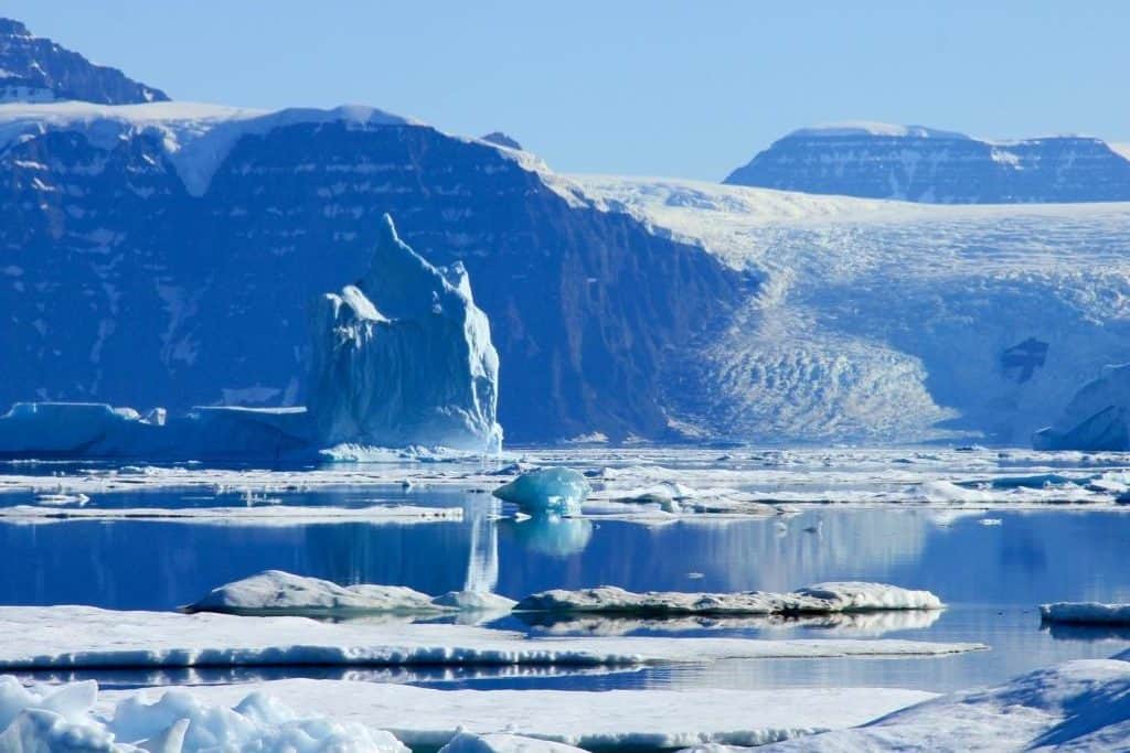 blue and white icebergs in shifting seas. Sail the Northwest Passage aboard Tecla with Classic Sailing