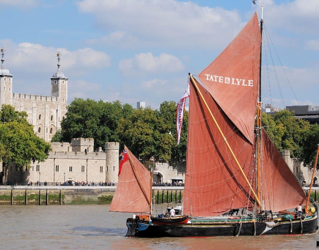 Thames Barge sailing past the Tower of London
