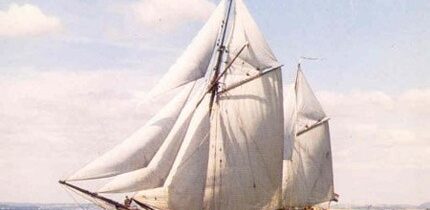 Historic photo of Dutch sail cargo ship De Tukker under full sail