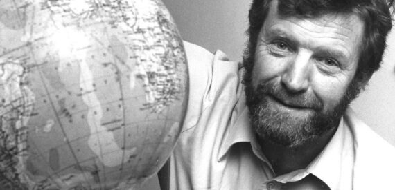 The late author and Explorer Kit Mayers with a globe. You can buy his book to help raise funds for Greenpeace.