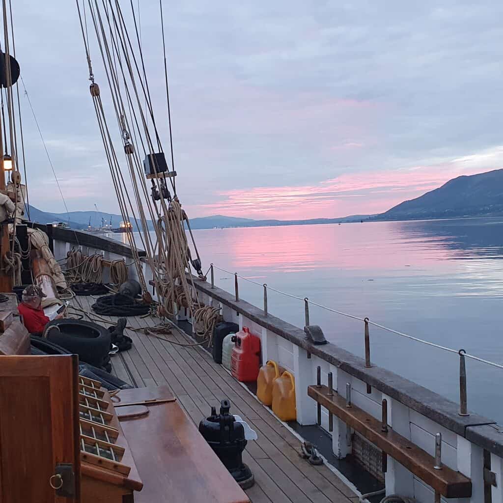 Twilight over the water- the view from the deck of Leader. Traditional sailing adventures with Classic Sailing.