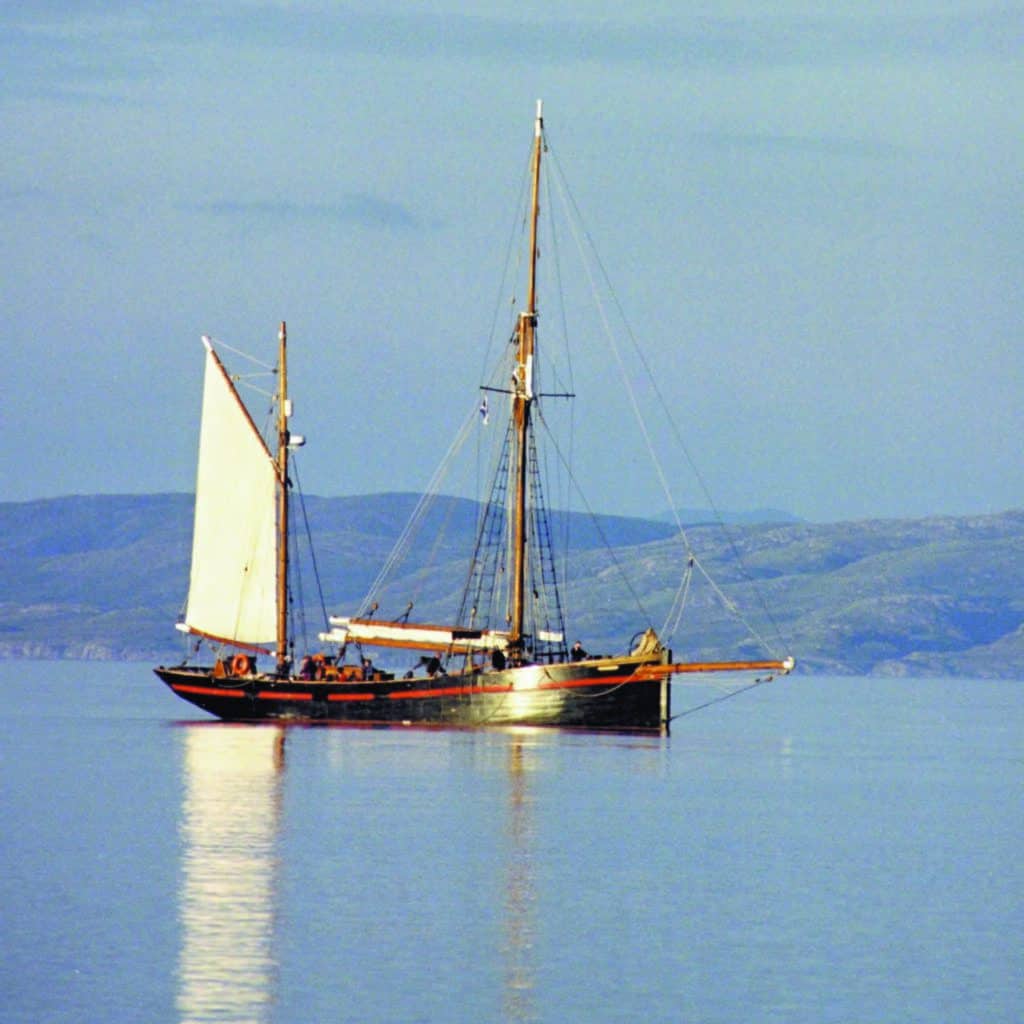Brixham Trawler Leader anchored in glassy seas