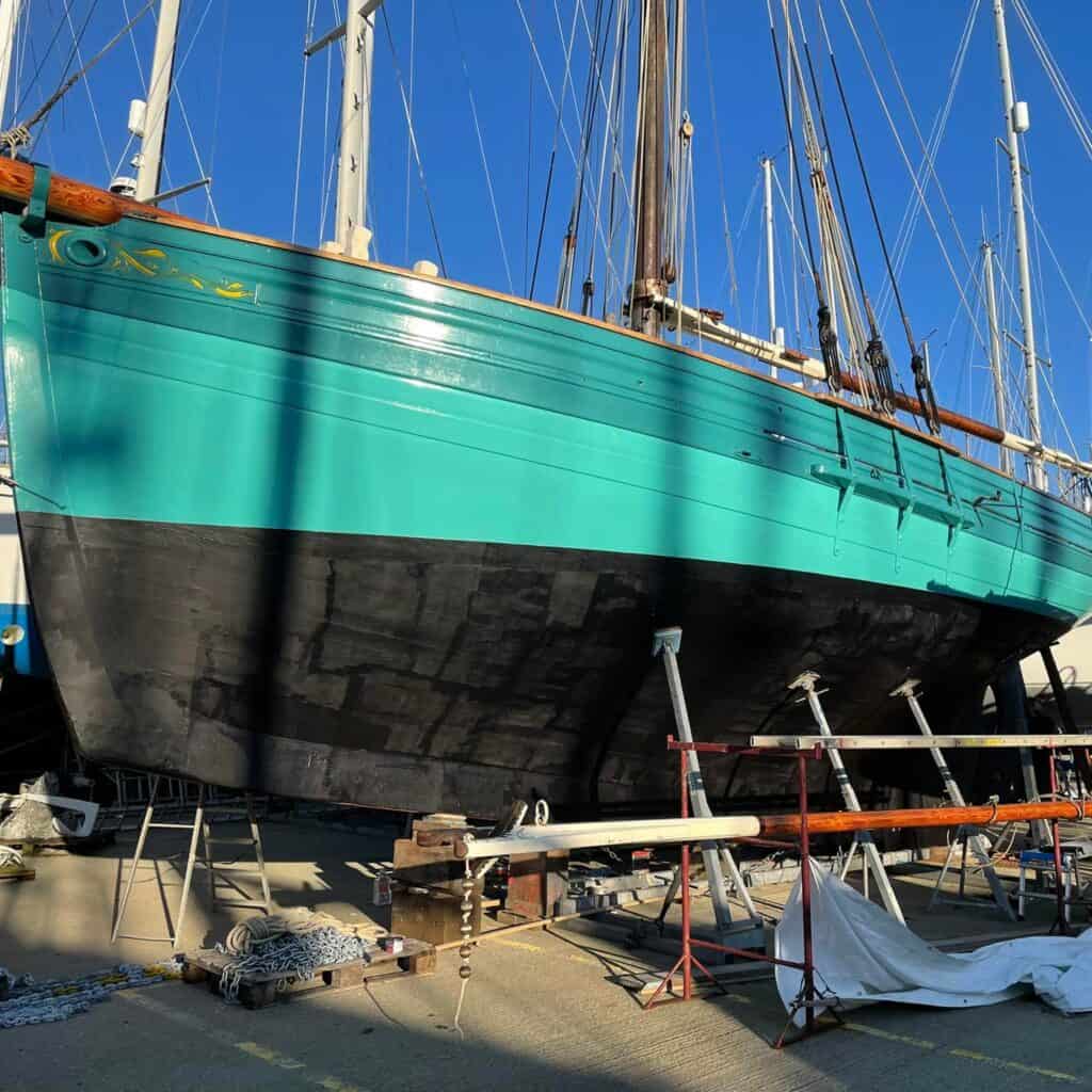 the underwater hull shape of tallulah in the boatyard