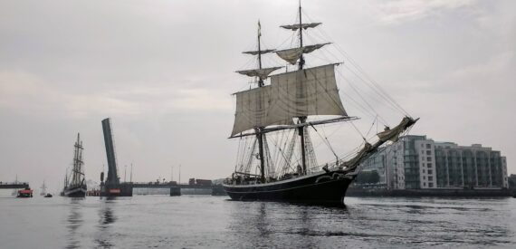 Morgenster leads the procession of Tall Ships into Dublin following completions of a Tall Ship race.